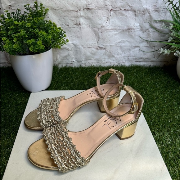 AGL
Crochet Penny Block Heel Sandal in Golden Platino color size 36.5 US 6.5 - Picture 5 of 14